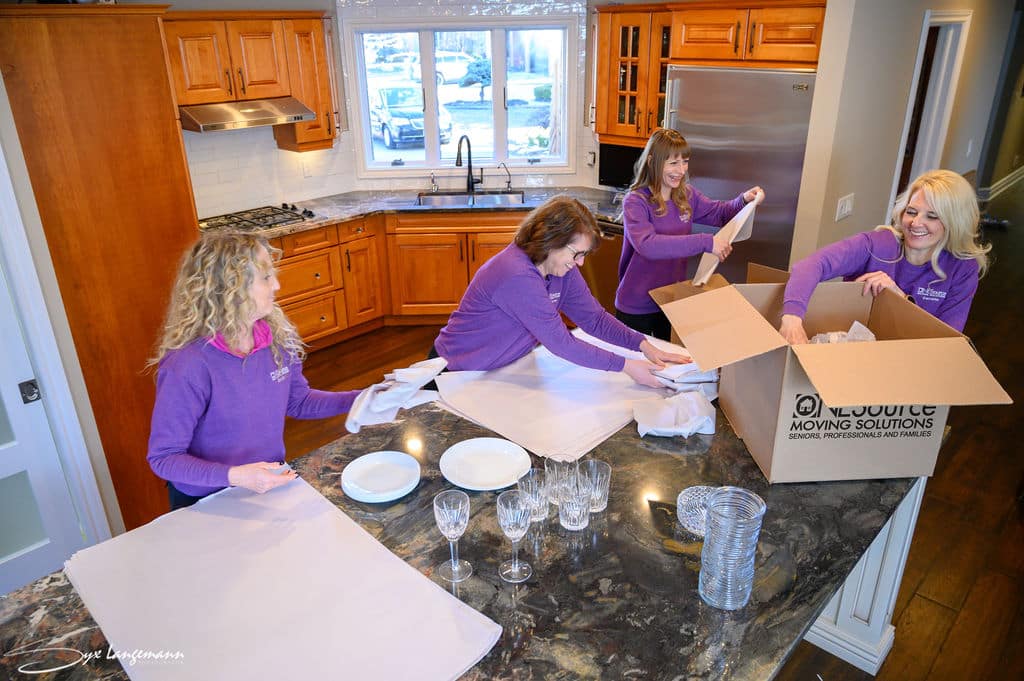 photo of ONESource Moving Solutions team packing